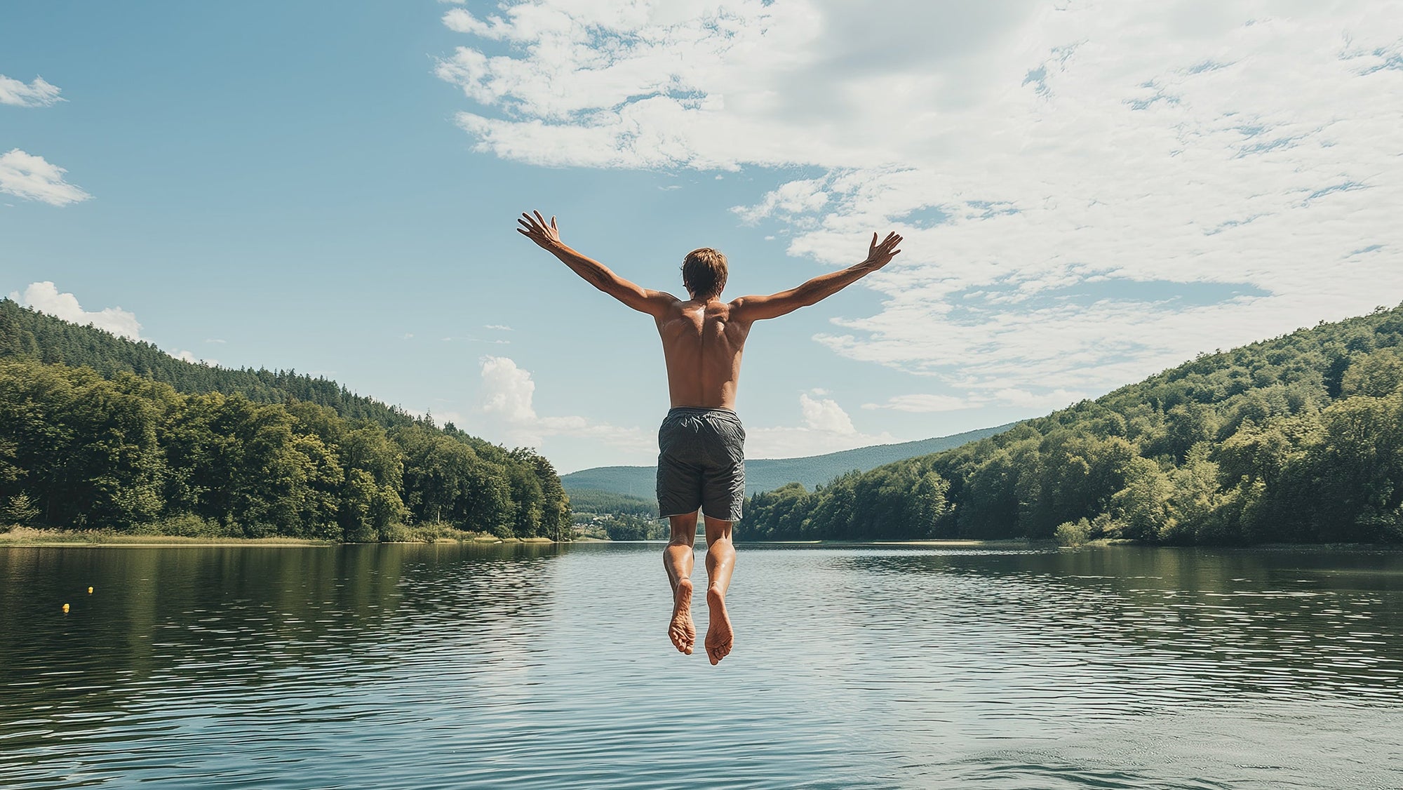 Person jumping off a dock